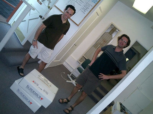 Zack Levow and Denis Kieft with the first shipment of Barracuda Spam and Virus Firewall